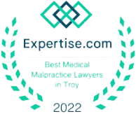 A green and white logo with the words " expertise. Com ".